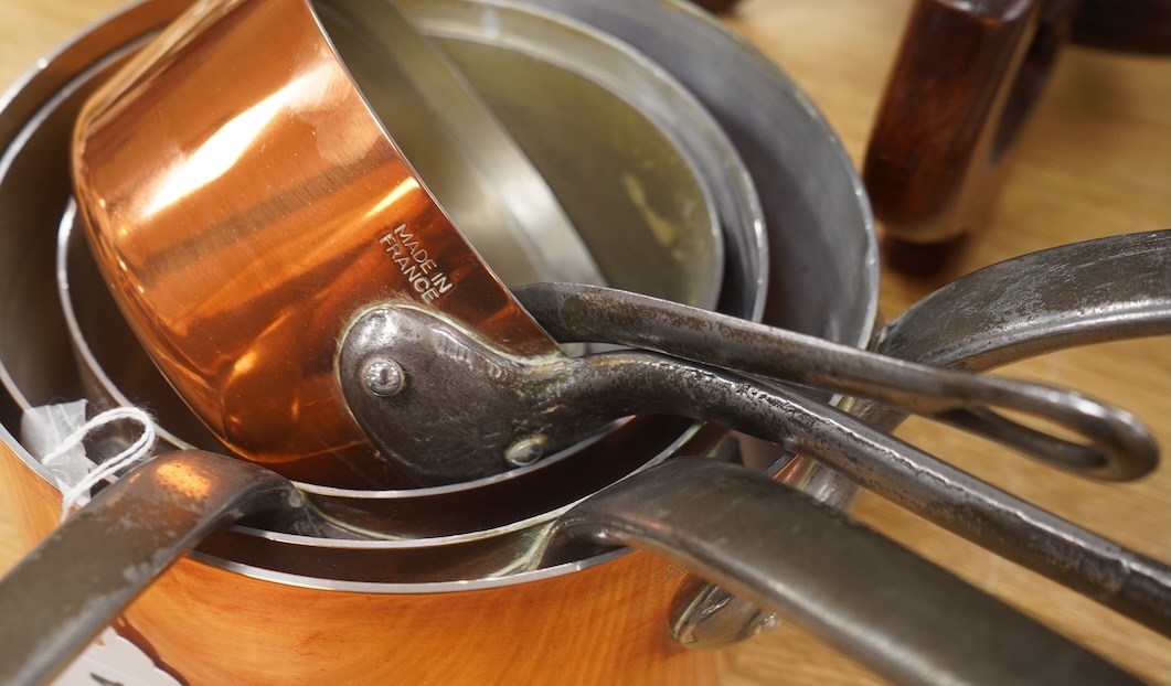 A set of five French graduated iron handled copper saucepans, largest 18.5cm diameter. Condition - good
